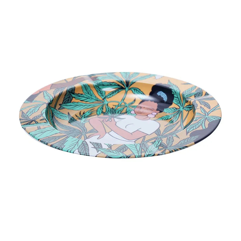 Decorative round ashtray with colorful leafy pattern and illustration of a woman in white dress