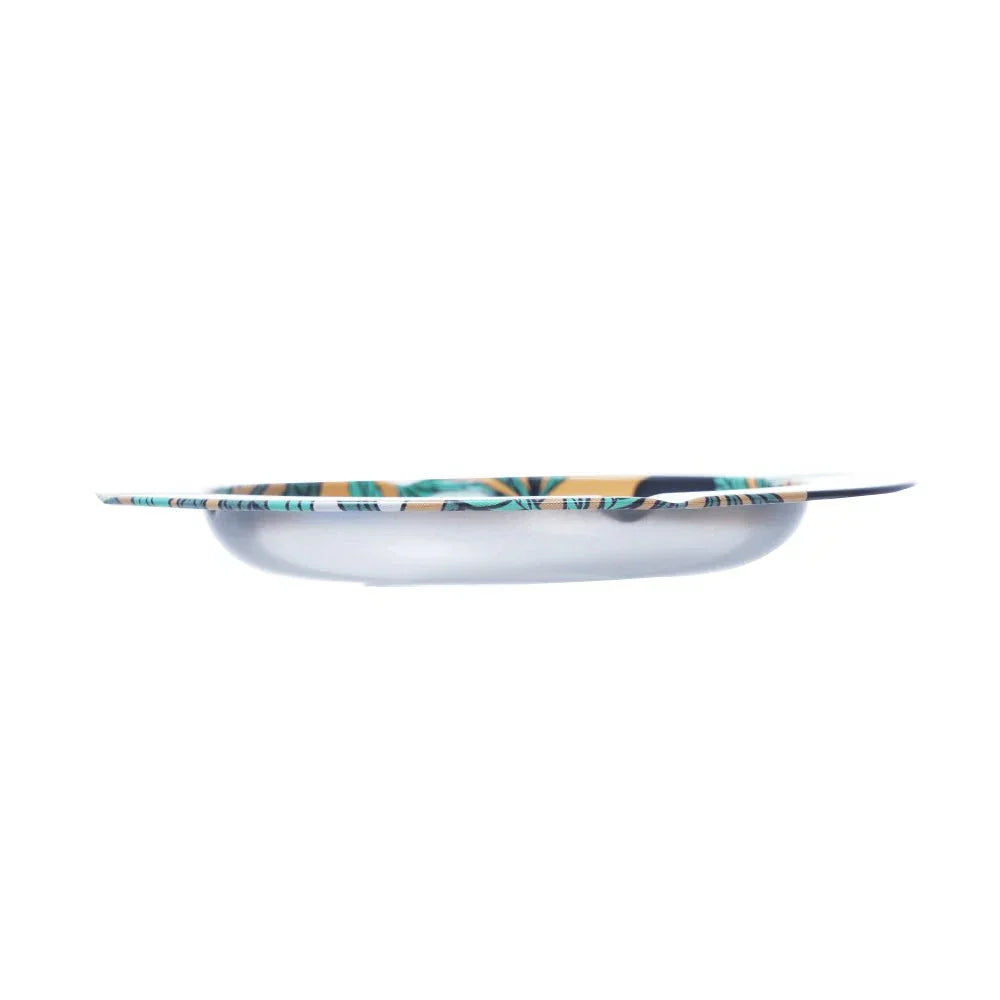 Side view of a shallow round tray with colorful abstract leaf pattern and smooth edges