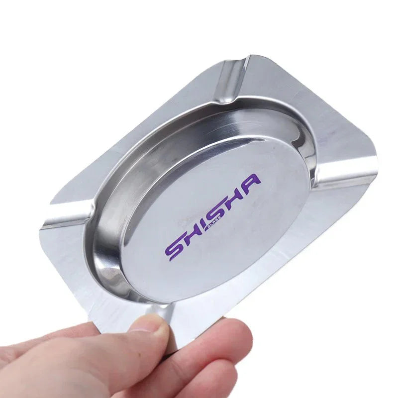 Hand holding shiny metal rectangular ashtray with oval center and purple Shisha logo