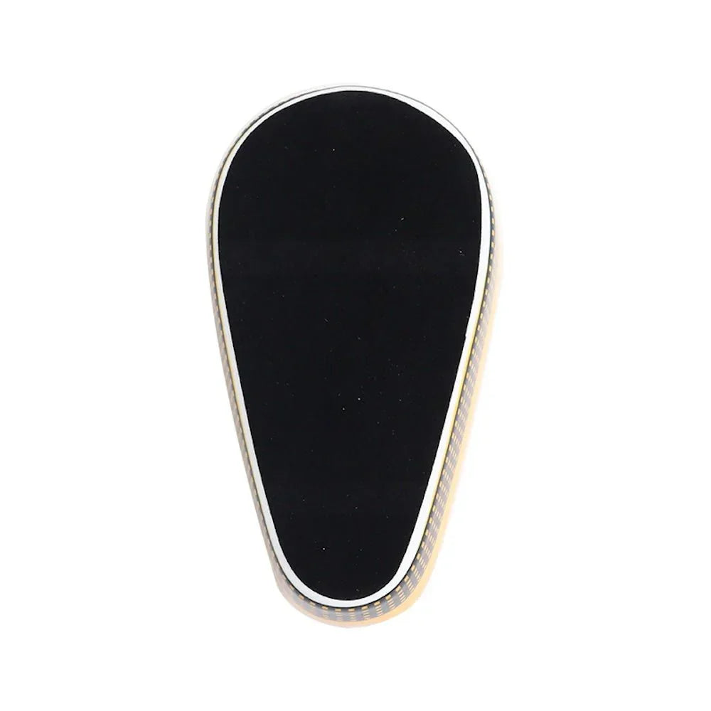 Top view of a black teardrop-shaped carbon fiber ashtray with white trim on white background