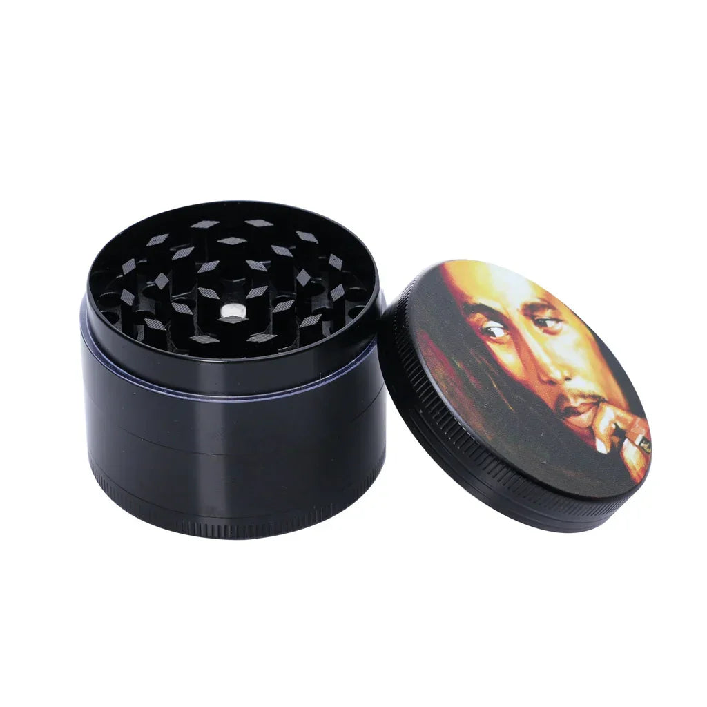 Black herb grinder with a removable lid featuring a portrait of a man with dreadlocks