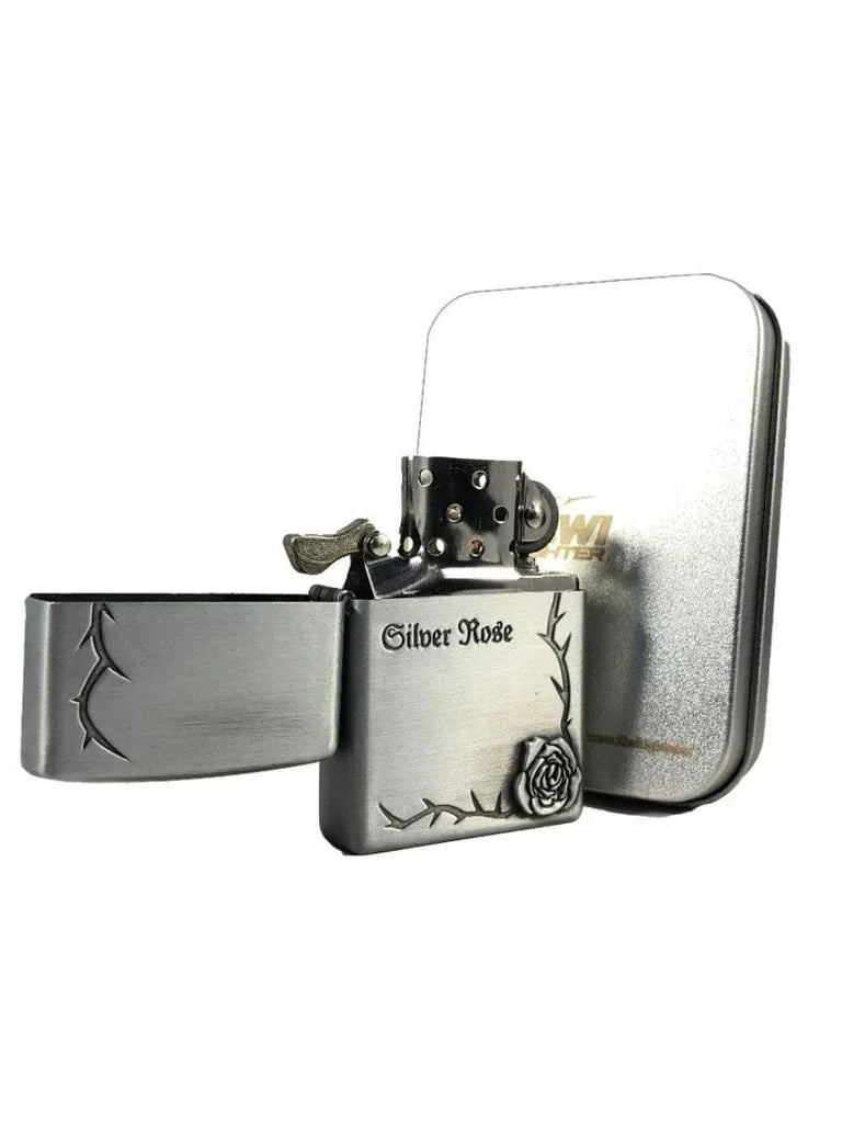 Silver Rose metal flip-top lighter with engraved thorn design and embossed rose detail, open with case