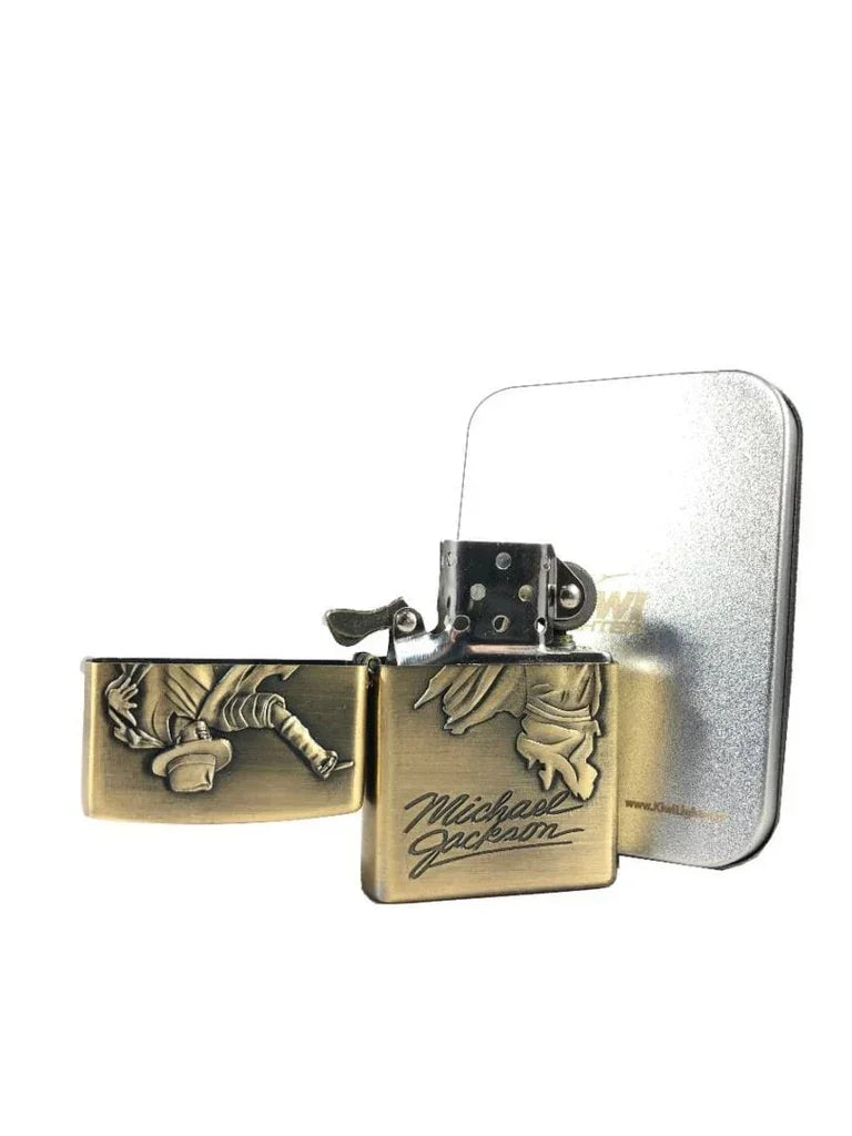 Bronze metal lighter with Michael Jackson engraving and figure, with silver tin box on white background