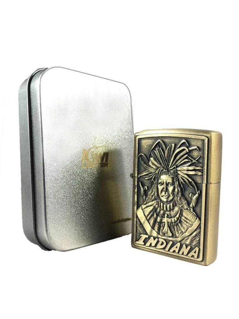 Antique brass lighter with detailed Native American chief engraving and Indiana text beside silver metal box