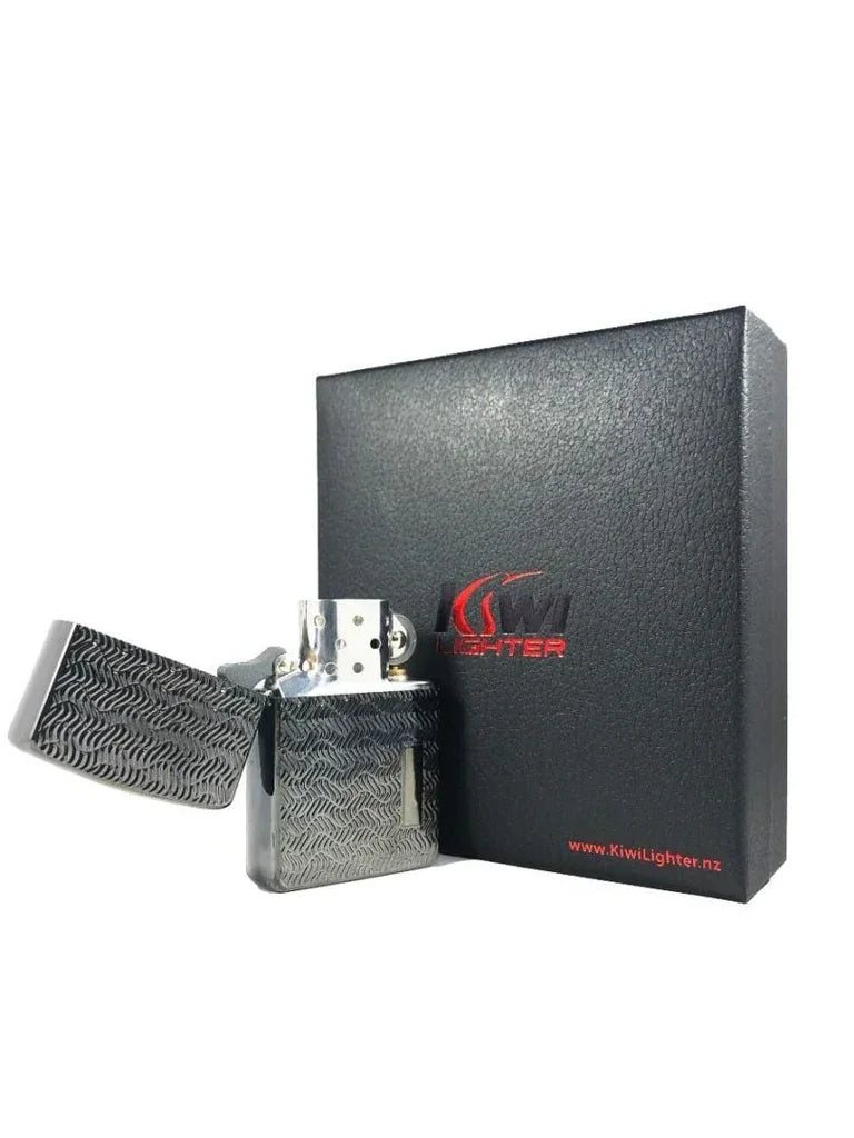Black textured metal windproof lighter open next to Kiwi Lighter black gift box