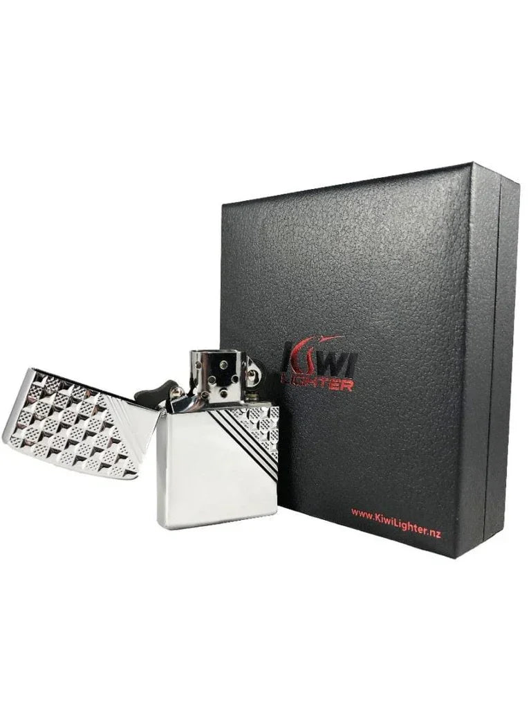 Chrome patterned flint lighter open beside black Kiwi Lighter gift box with red logo