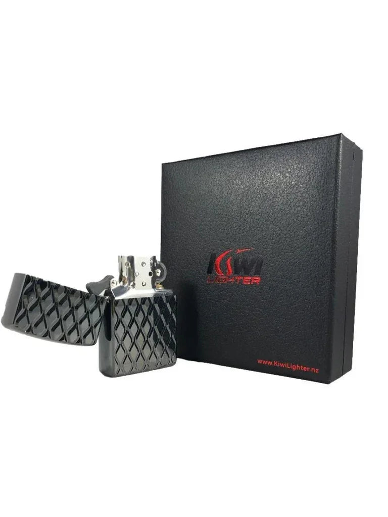 Black textured metal flint lighter with open lid beside black Kiwi Lighter branded box