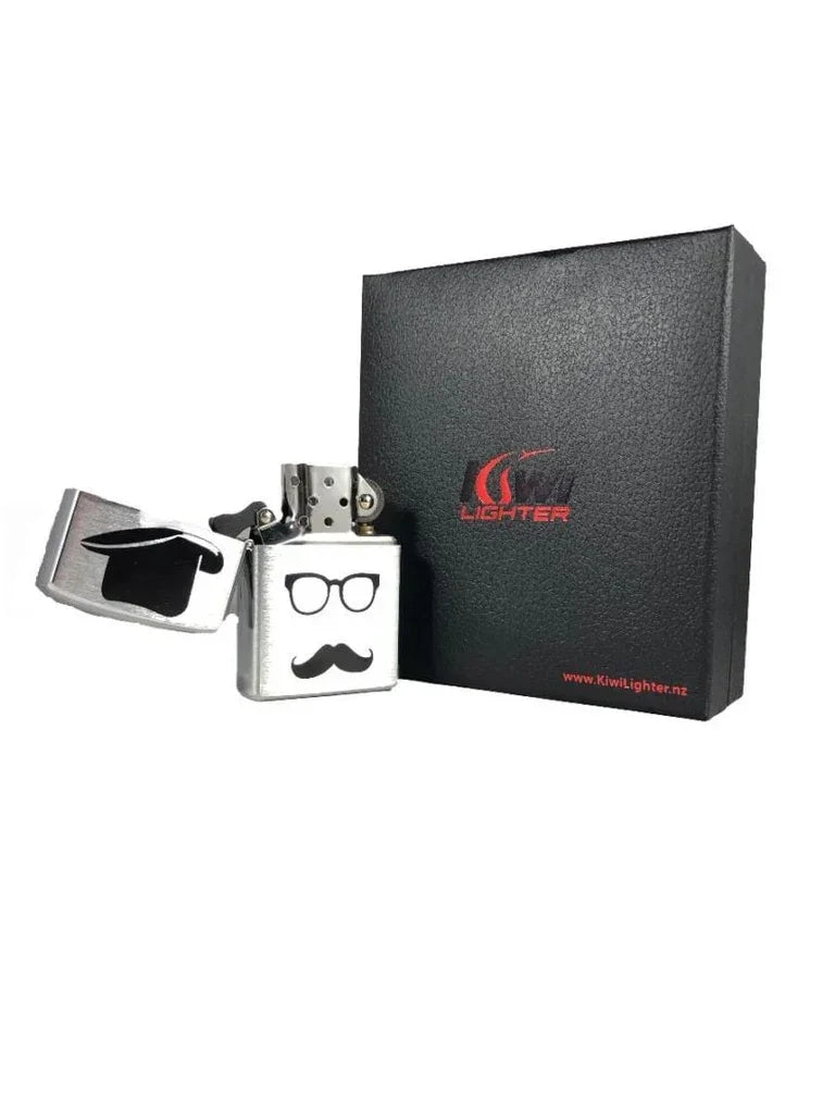 Silver metal flip-top lighter with glasses and mustache design beside black Kiwi Lighter gift box