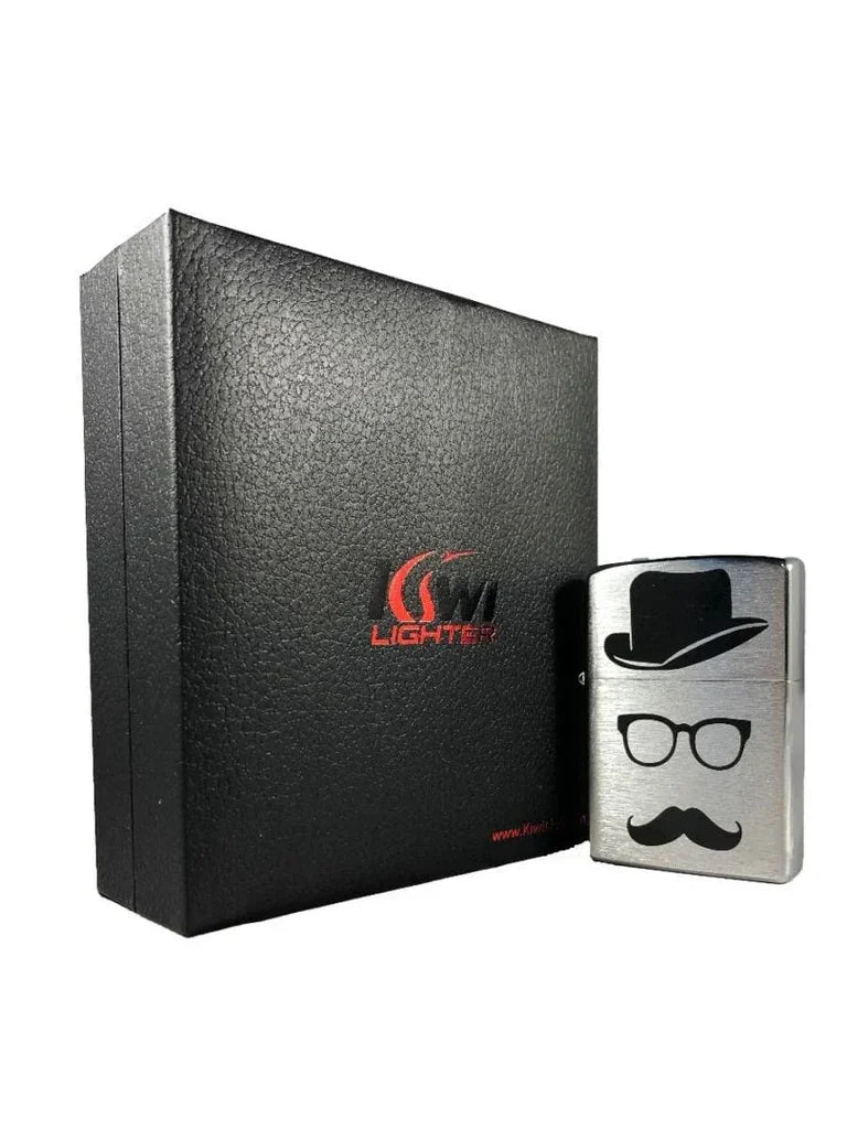 Silver metal lighter with black hat, glasses, and mustache design next to black textured lighter box