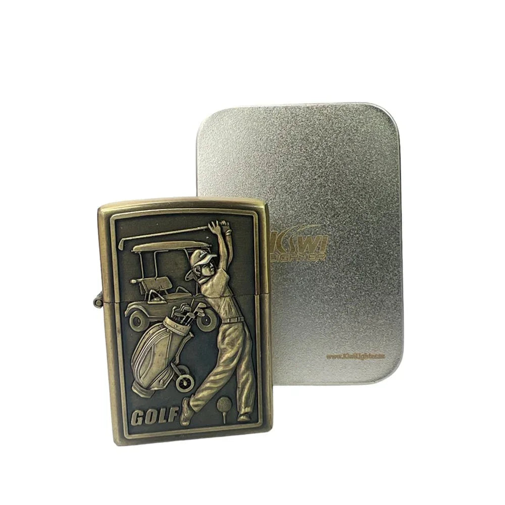 Vintage brass golf-themed lighter with golfer and golf cart design beside metal box