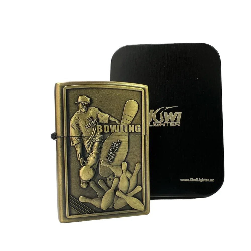 Antique brass bowling-themed flint lighter with embossed bowler and pins, black Kiwi Lighter box