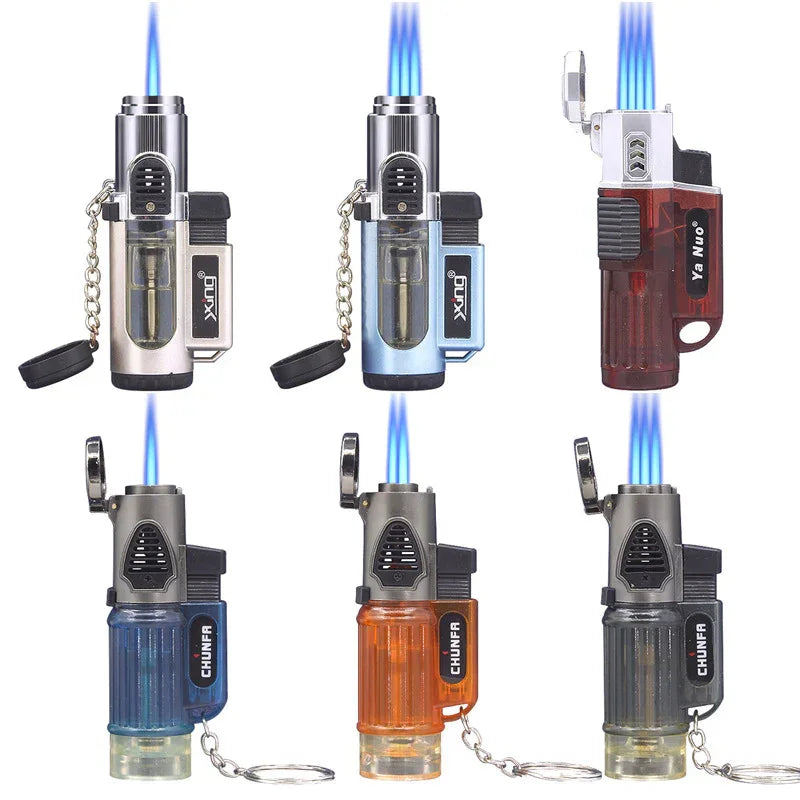 Six colorful jet lighters with blue flame, transparent fuel tanks, various designs, and keychain attachments