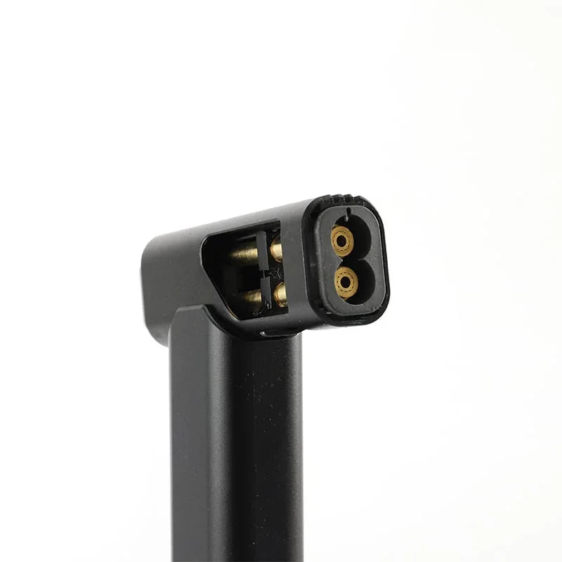 Close-up of black jet torch lighter nozzle with dual gas outlets on white background