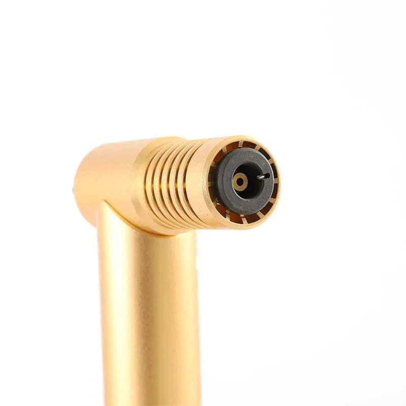 Close-up of gold-colored jet torch lighter nozzle with black ignition tip on white background
