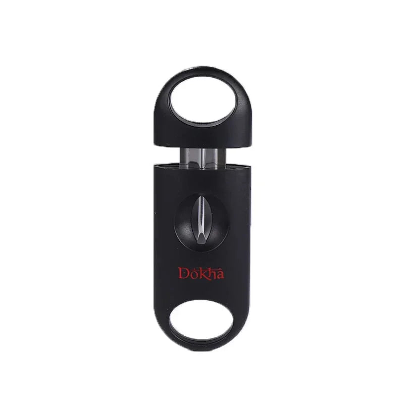 Black Dokha cigar cutter with circular grips and stainless steel blade on white background