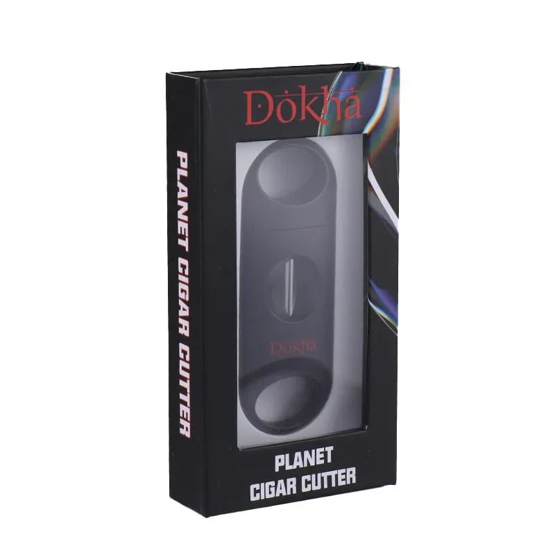 Dökha Planet black cigar cutter in black packaging with clear window and white text