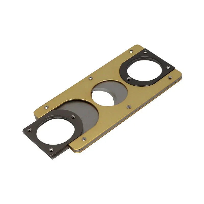 Compact metal cigar cutter with double guillotine blades and gold and black finish